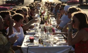 People eating at long table